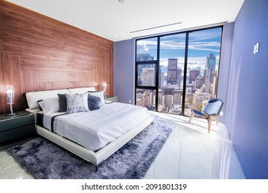 Modern and contemporary bedroom in Seattle with views of the financial district of the city. Condo or Hotel accommodation. Very Peri colored walls.