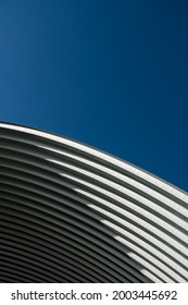 Modern Contemporary White Grey Metal Curve Architecture On Blue Sky Background