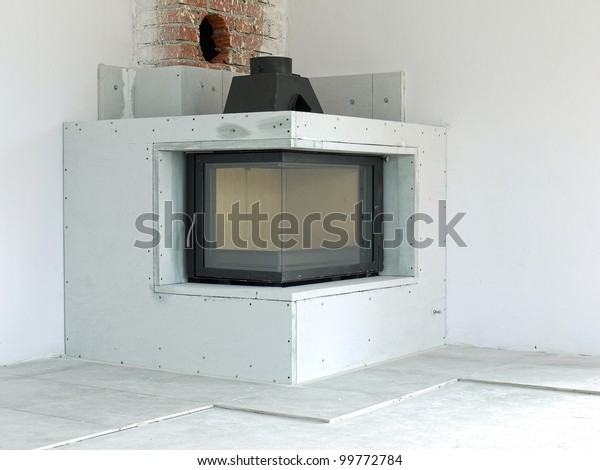 Modern Corner Woodfired Fireplace Under Construction Stock Photo