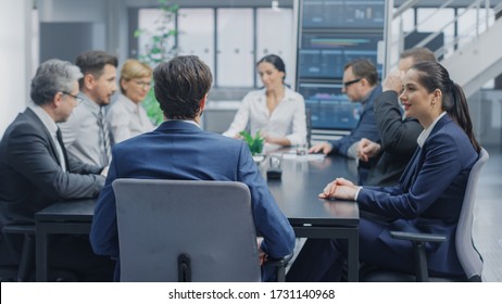 In The Modern Corporate Office Meeting Room: Diverse Group Of Businesspeople, Lawyers, Executives And Members Of The Board Of Directors Talking, Negotiating And Working On A Winning Strategy.