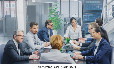 In The Modern Corporate Office Meeting Room: Diverse Group Of Businesspeople, Lawyers, Executives And Members Of The Board Of Directors Talking, Negotiating And Working On A Winning Strategy.