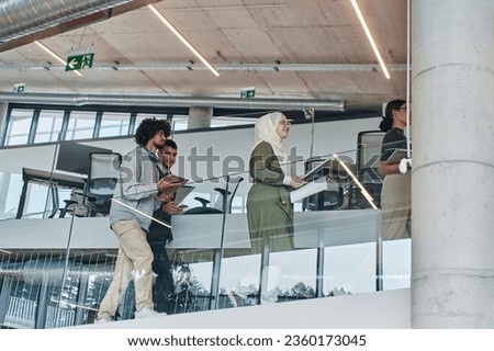 In the modern corporate world, a diverse group of businesspeople, representing various backgrounds and cultures, briskly walks through the hallway of a cutting-edge startup office, exemplifying