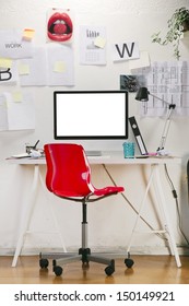 Modern Creative Workspace With Computer And Red Chair. The Office Of A Creative Worker.