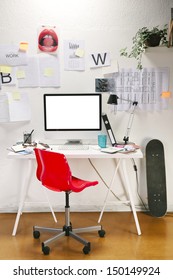 Modern Creative Workspace With Computer And Red Chair. The Office Of A Creative Worker.