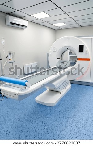 Modern CT scanner machine in a bright medical room. Interior of a clean hospital room featuring a computed tomography scanner and patient table under bright light.
