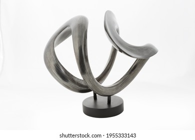 Modern curved vase sculpture isolated white background