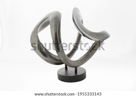Modern curved vase sculpture isolated on white background
