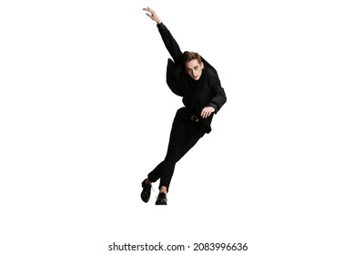 Modern Dance. Young Man In Black Business Suit Dancing Isolated On White Background. Art, Motion, Action, Flexibility, Inspiration And Ad Concept. Flexible Ballet, Contemporary Dancer Weightless Moves