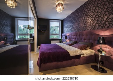 Modern, dark interior design: bedroom with king size bed