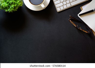 Modern Dark Surface Office Desk Table With Computer And Cup Of Coffee. Hero Header Concept With Copy Space.