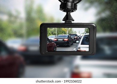 Modern dashboard camera mounted in car, view of road during driving - Shutterstock ID 1992106022