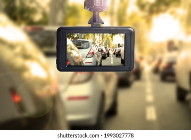 Modern dashboard camera mounted in car, view of road during driving - Shutterstock ID 1993027778
