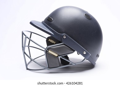 Modern day cricket batting helmet with protective grill on white background - Powered by Shutterstock