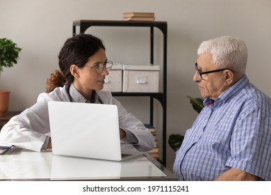 Modern day doc. Confident young woman attending physician consult aged man patient explain therapy details using laptop. Female gp talk to older male visitor show electronic prescription on pc screen - Powered by Shutterstock