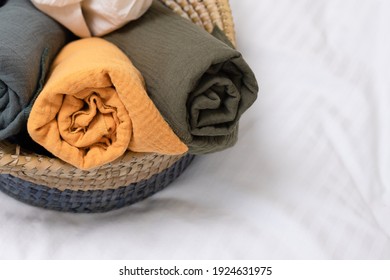 Modern Decor For Cozy Home, Natural Fabrics, Beautiful Things Made From Natural Materials. Rolled Up Muslin Sheets In Basket. Nobody. Horizontal. Spa, Home Decor, Baby Care, Storage Of Things Concept.