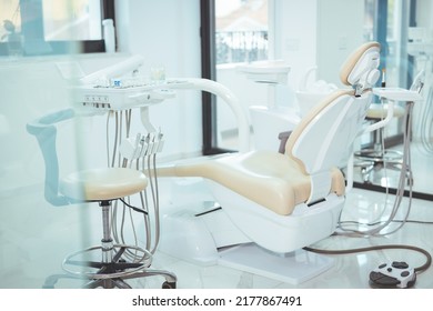 Modern dental practice. Dental chair and other accessories used by dentists. Dentist Office, Dental Hygiene, Dentist's Chair. dentistry, medicine, medical equipment and stomatology concept 