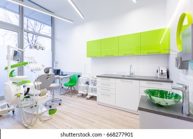 Modern Dental Room With Green And White Furniture