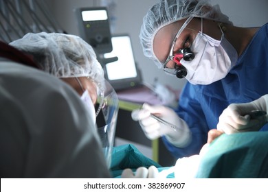 modern dental surgery, face of a female doctor working on a patient