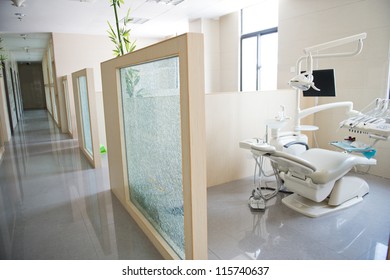 Modern dentistry office interior with chair and tools.