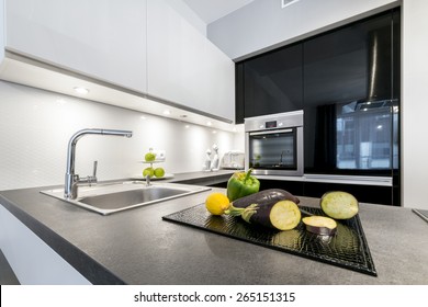 Modern Design Kitchen With Electric Appliances And Stone Worktop