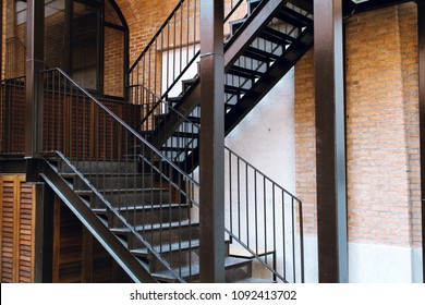 Modern design metal staircase and concrete building 