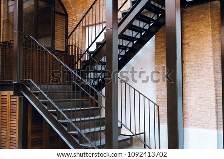 Modern design metal staircase with concrete building.