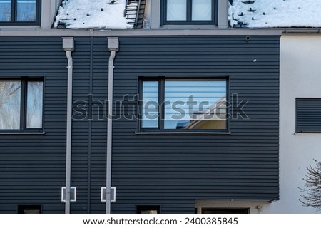 Modern design residential house details, windows, at winter in Germany