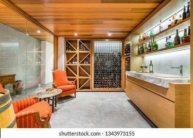 A modern design wine cellar with timber ceiling and contemporary furniture. PERTH, AUSTRALIA. Photographed: November, 2018.