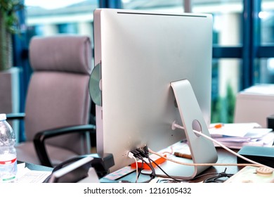 Modern Desktop All-in-one Computer On A Cluttered Business Room.