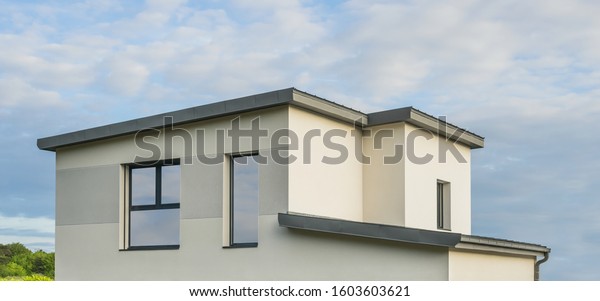 Modern detached house\
with flat roof \
