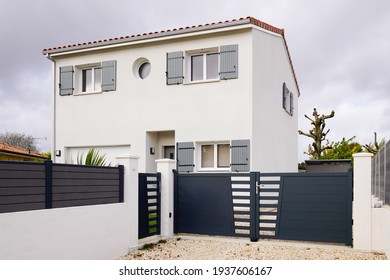 Modern detached storey house with metal gate grey fence on suburb street home