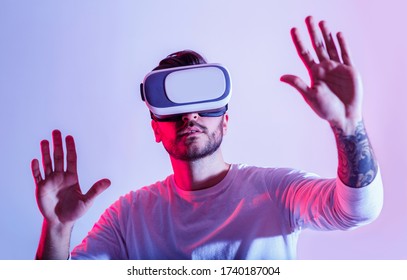 Modern digital entertainment. Millennial man uses virtual glasses close up, free space - Shutterstock ID 1740187004