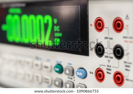 Modern digital measuring instruments. Multimetric equipment. Abstract industrial background.