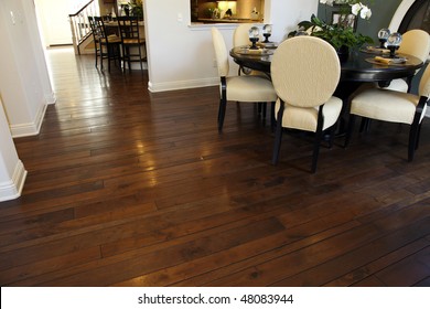 Modern Dining Table And Hallway With Hardwood Flooring.