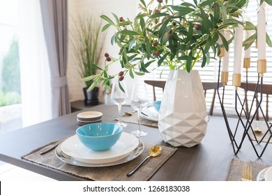 Modern Dinning Room Interior With Blue Plate On Wood Table At Home.