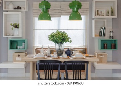 Modern Dinning Room With Wooden Table And Black Chair At Home