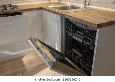 Modern Dishwasher Built-in Wood Worktop.