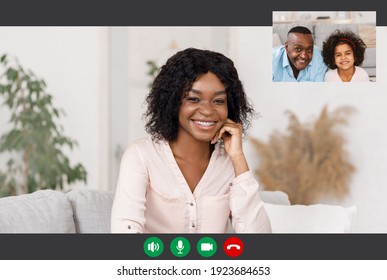 Modern Distant Communication. Portrait Screen View Of Cheerful Young Black Woman Making Online Video Call With Family, Smiling Lady In Braces Talking With Father And Daughter On Virtual Meeting