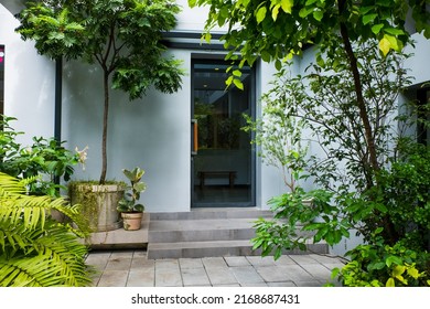 Modern door in summer garden. - Shutterstock ID 2168687431