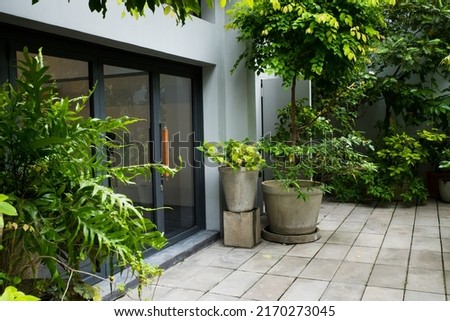 Modern door in summer garden.
