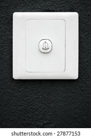 Modern Doorbell On Black Wall