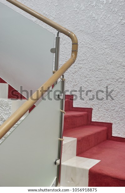 Modern Downward Marble Staircase Red Carpet Stock Image
