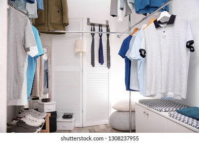 Clothes Hanging On Rack At Modern Dressing Room Stock Photos