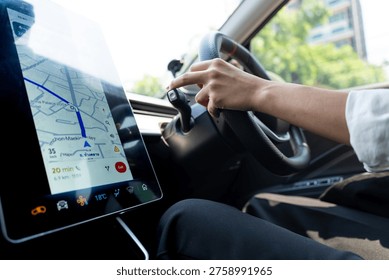 Modern driver using GPS navigation on a large touchscreen in a high-tech electric vehicle. Concept of smart mobility, urban commuting, and future automotive technology.