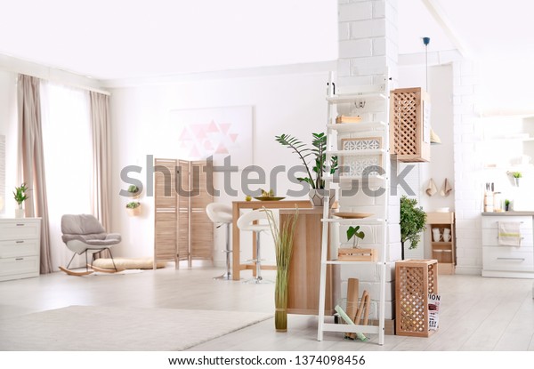 Modern\
eco style interior with wooden crates and\
shelves