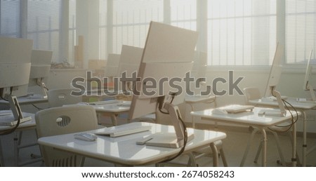 Modern Educational Space with Computer Desks, White Monitors. Computer Science Classroom Prepared for Interactive Learning, Digital Skills Training and Technology-Based School Activities. Dolly Shot.
