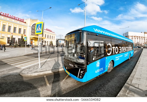 modern\
electric bus of Moscow city public transportation system at bus\
stop against moscow savelovsky train station building landmark\
background MOSCOW, RUSSIA - CIRCA MARCH,\
2020