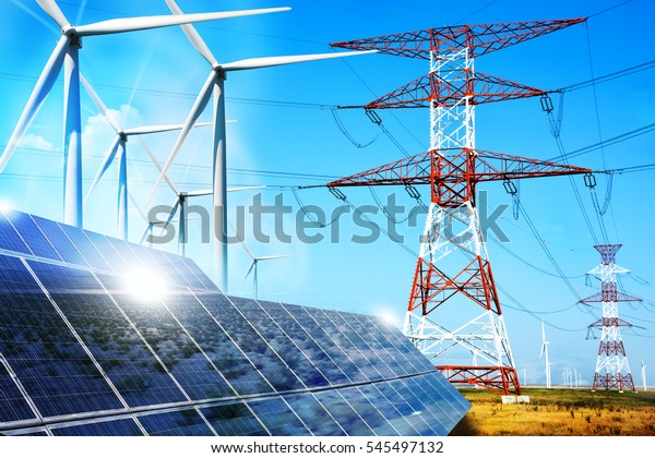 Modern electric grid lines and\
renewable energy concept with photovoltaic panels and wind\
turbines
