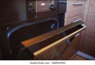 Modern Electric Oven In Kitchen Interior With Open Door Close Up