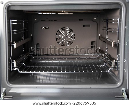 Modern electric oven with telescopic rails, top and bottom heat. Function 3D hot air, thermal grill and convection.
